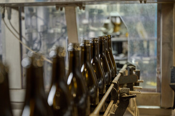 Wine bottles on a bottling line at a winery in France