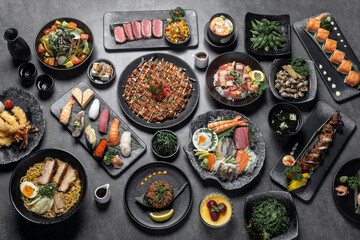 many traditional japanese food dishes variety on grey background - 629429806