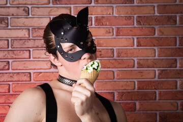 Young attractive guy in a leather cat mask. Adult games.
