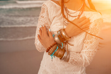 Model in boho style in a white long dress and silver jewelry on © svetograph