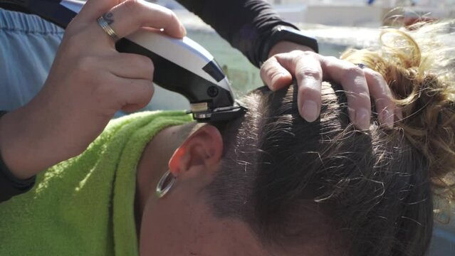 Woman Hairdresser Shaving Head Of Young Woman, Slow Motion Close-up Shot