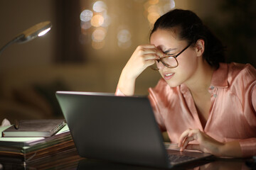 Entrepreneur working suffering eyestrain in the night