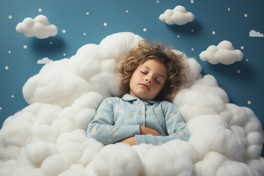 Kid sleeps on a cloud like in the bed 