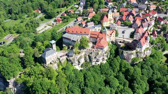 Drone video, flight over the forests of the Saxon Switzerland National Park, historic medieval castle and the old town, Hohnstein, Saxony, Germany, Europe