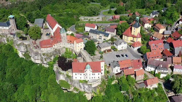 Drone video, flight over the forests of the Saxon Switzerland National Park, historic medieval castle and the old town, Hohnstein, Saxony, Germany, Europe