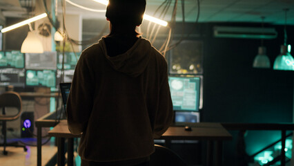 Group of thieves working with dark web to do illegal phishing on online network, trying to steal information illegally. Team of hackers breaking into server for cyberwarfare. Handheld shot.