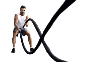 Athletic young man with battle rope doing exercise in functional training on a transparent background - obrazy, fototapety, plakaty