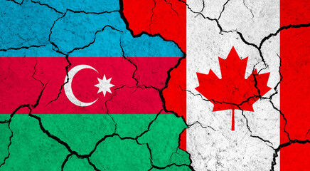 Flags of Azerbaijan and Canada on cracked surface - politics, relationship concept