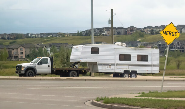 Calgary, Alberta, Canada. July 30, 2023. A truck towing a camper RV trailer during summer.