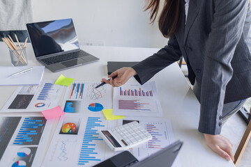 Businessman working at office with documents on his desk, doing planning analyzing the financial report, business plan investment, finance analysis concept	