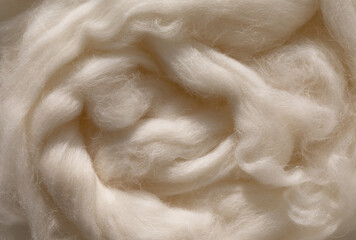 Closeup woolen fiber in neutral beige color as background. Natural material in aesthetic sunlight.