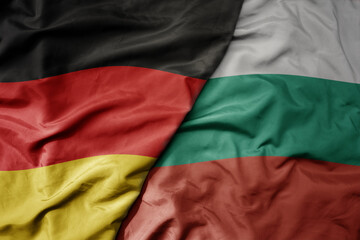 big waving realistic national colorful flag of germany and national flag of bulgaria . - obrazy, fototapety, plakaty