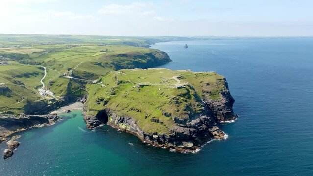 Rugged coastline on the Celtic Sea with the Tintagel Peninsula and the ruins of Tintagel Castle, North Cornwall, England, United Kingdom, Europe