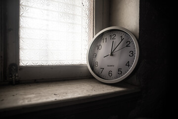 Time concept. Old rustic wall clock on old wooden table with copy space