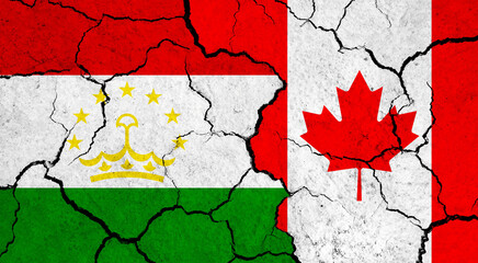 Flags of Tajikistan and Canada on cracked surface - politics, relationship concept