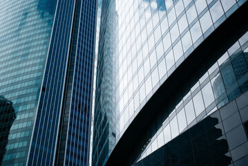 Fototapeta na wymiar Commercial business district, modern high glass blue windows skyscrapers exterior