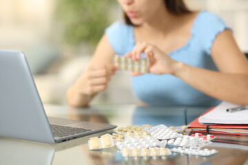 Student taking a lot of pills at home