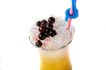 A tall glass of icy cold refreshment filled with fresh berries, perfect for a healthy snack or drink.
