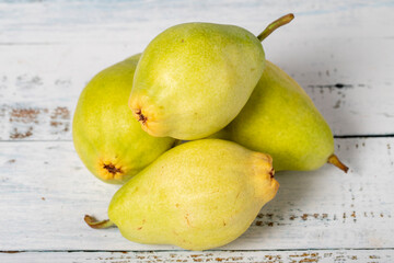 Pear on a white wood background. Fresh pear harvest season concept. Healthy and fresh fruit. Close up