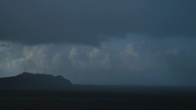 Before the typhoon comes, the seaside is covered with changing clouds. The Fugui Cape Lighthouse in Shimen. Taiwan
