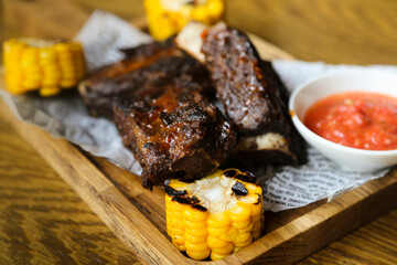 Roasted ribs with corn and tomato sauce