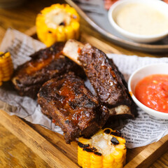Roasted ribs with corn and tomato sauce