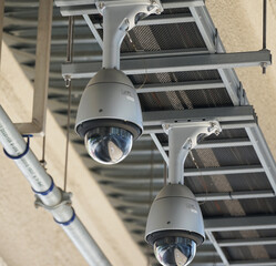 Security cameras installed on the ceiling of public buildings