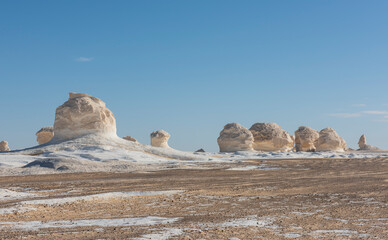 Barren desert landscape in hot climate with rock formation