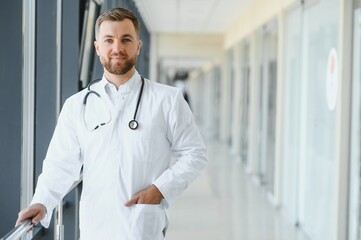 Young male doctor in a corridor of a general hospital