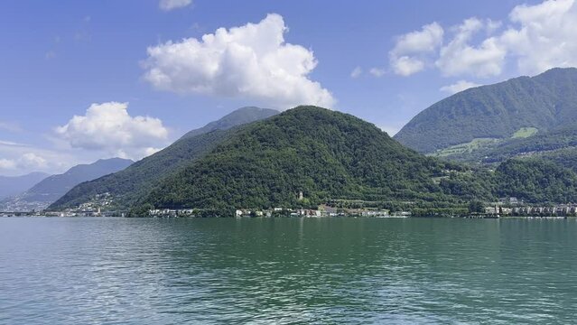 Panoramic View over Alpine Lake Lugano and Mountain in a Sunny Day in Melide and Bissone in Ticino, Switzerland.