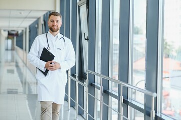 Young male doctor in a corridor of a general hospital