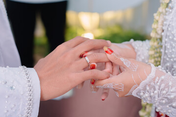 bride and groom holding hands