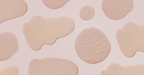 Drops and smears of cosmetics in different sizes. Drops of liquid gel with bubbles on a beige background. Banner. Cream mockup. Natural skin care concept