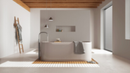 Blurred background, minimalist wooden bathroom. Resin floor, freestanding bathtub with towels and decors. Japandi interior design