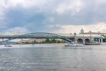 View of the Moscow river embakment, Pushkinsky bridge and cruise ships at sunset.