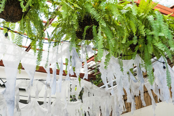 Old dirty torn rag hanging decoration at home.