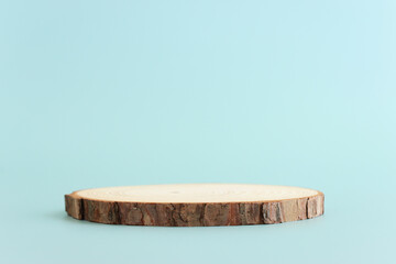 Wooden board over pastel color background. For cosmetics, aesthetics, and objects mockup