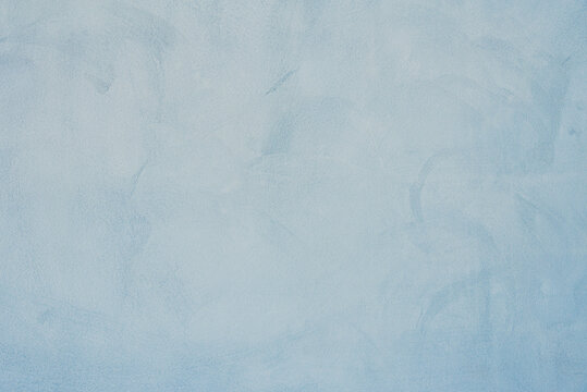 Decorative light blue painted wall background. Beautiful abstract stucco texture,wall decor for design.