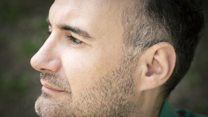 Obraz premium profile portrait of man with gray hair and beard