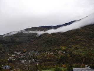 Clouds on mountains green valley white sky foggy