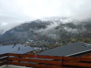 Clouds on mountains green valley white sky foggy