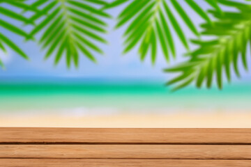 Fototapeta na wymiar Summer beach party vibes with an empty wooden table and palm leaves against a blurred beach background. Perfect for summer time celebrations