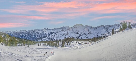 Panoramic image of a ski slope in Ifen ski resort in Kleinwalsertal valley in Austria