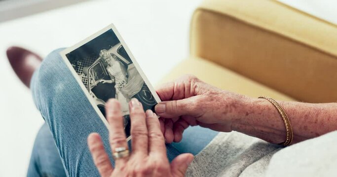 Hands, picture and memory with a senior person thinking about the past while in a nursing home. History, vintage and retirement with an elderly adult holding a photograph closeup to remember life
