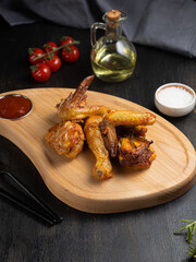 Honey Barbecue glazed chicken wings on darl background