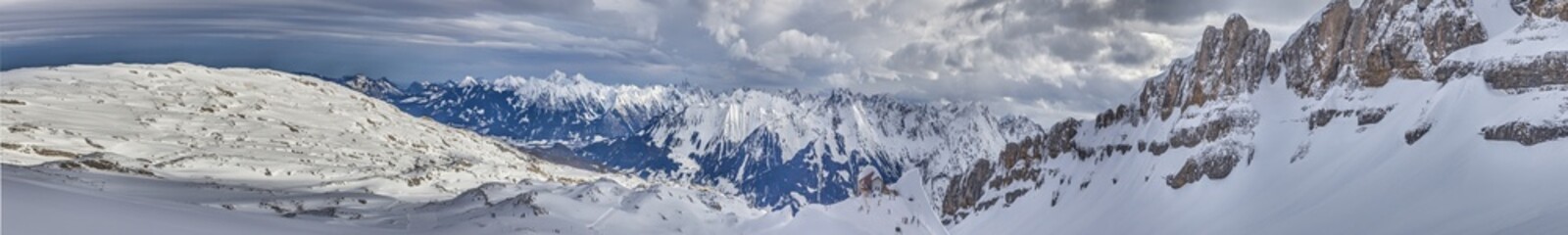 Panoramic image of a ski slope in Ifen ski resort in Kleinwalsertal valley in Austria