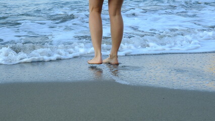 woman walking by the sea