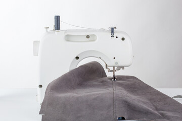 Sewing machine, stitching fabrics, needle in a round plan