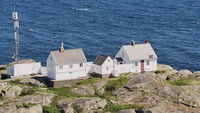 Stavernsodden Small Lighthouse Stands On Rocky Coastal Sea Of Larvik In Norway. aerial