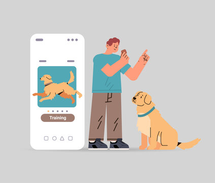 guy owner with cute dog using training app best friends domestic animal friendship concept